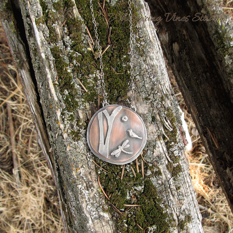 A Woodland Pendant Necklace in Sterling Silver and Copper